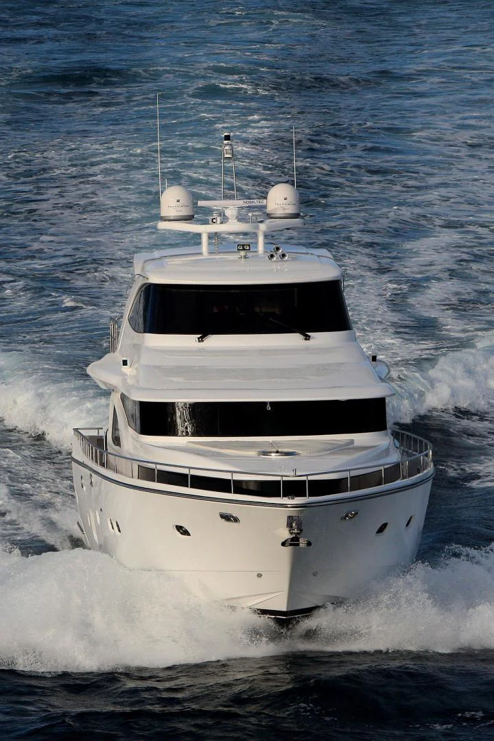 a white boat in the water aboard JOHNSON 80' FLYBRIDGE W/FISHING COCKPIT Yacht for Sale