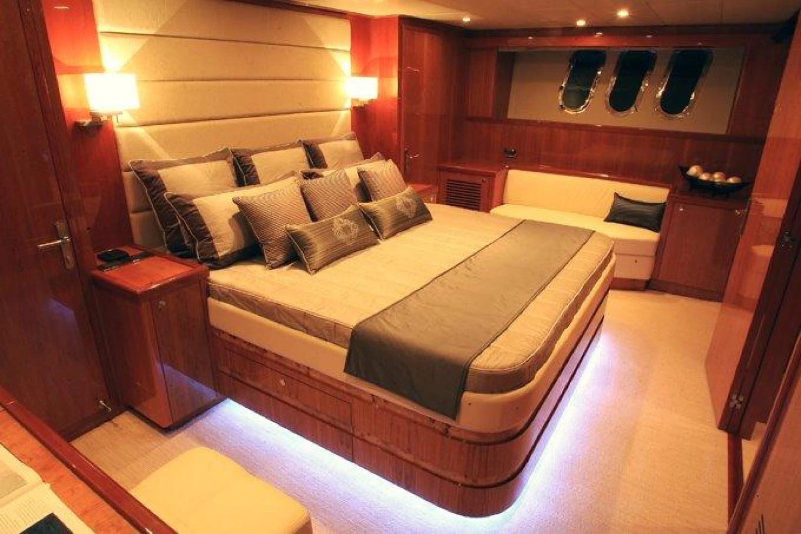 a bedroom with a bed and a desk aboard JOHNSON 80' FLYBRIDGE W/FISHING COCKPIT Yacht for Sale