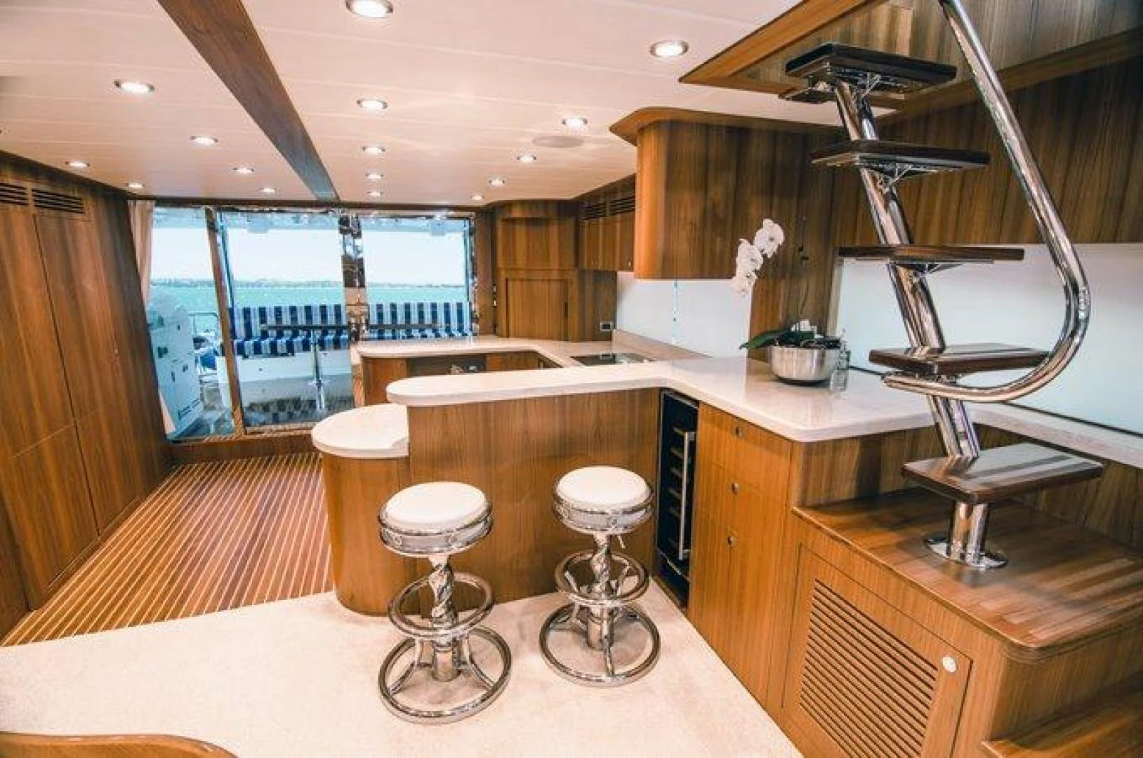 a modern kitchen with a large window aboard JOHNSON 80' FLYBRIDGE W/FISHING COCKPIT Yacht for Sale