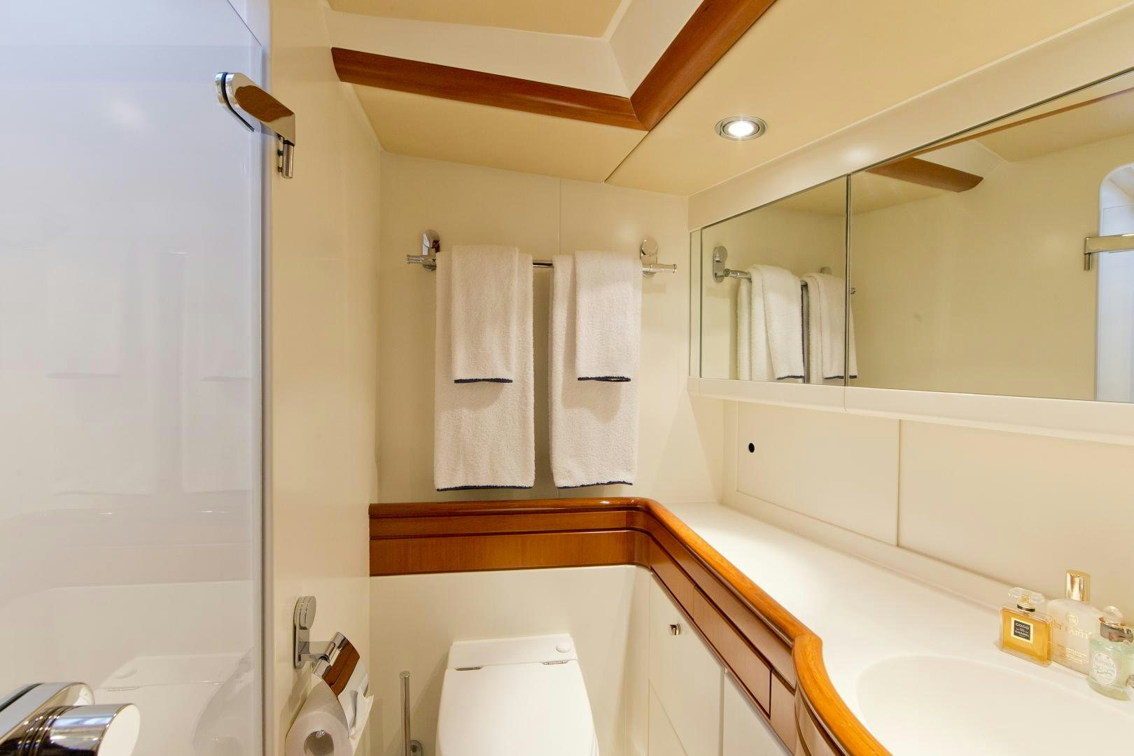 a bathroom with a large mirror aboard METOLIUS Yacht for Sale