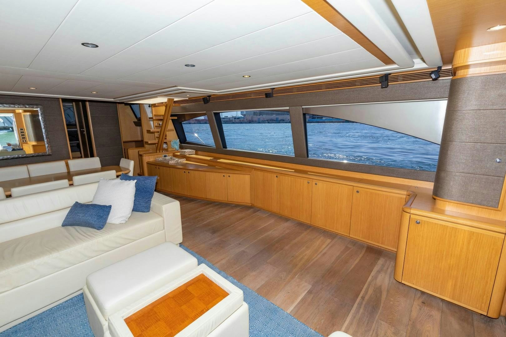 a room with a bed and a large window aboard MI RX Yacht for Sale