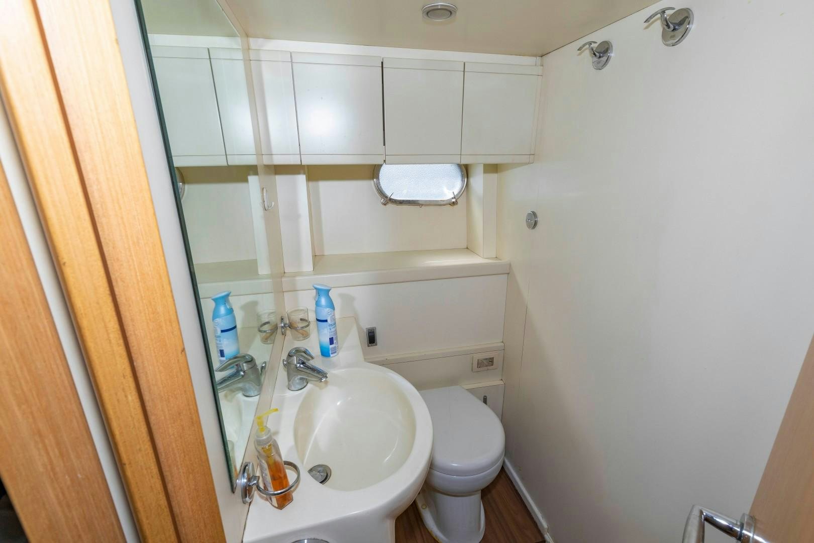 a bathroom with a sink and toilet aboard MI RX Yacht for Sale