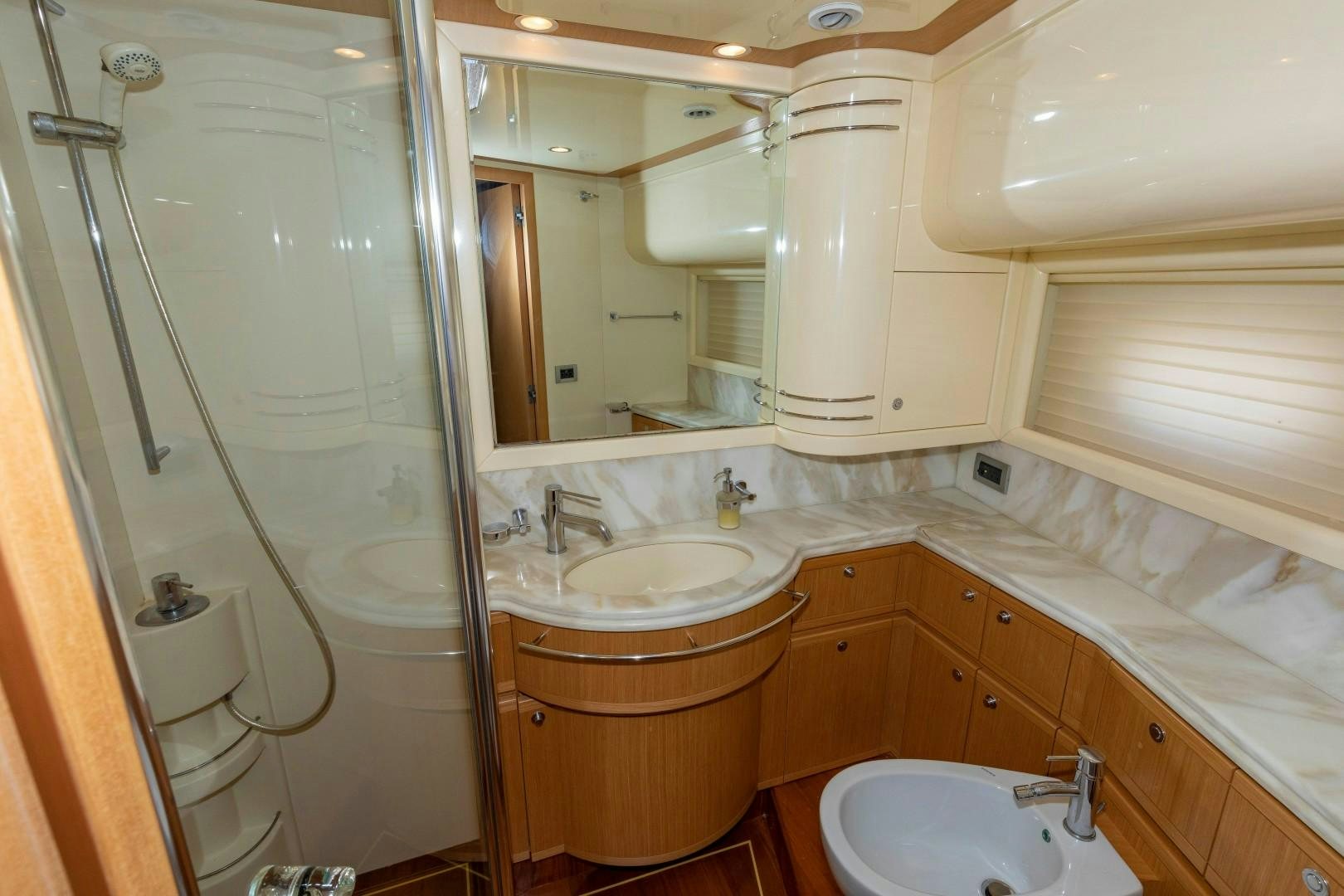 a bathroom with a large mirror aboard MI RX Yacht for Sale