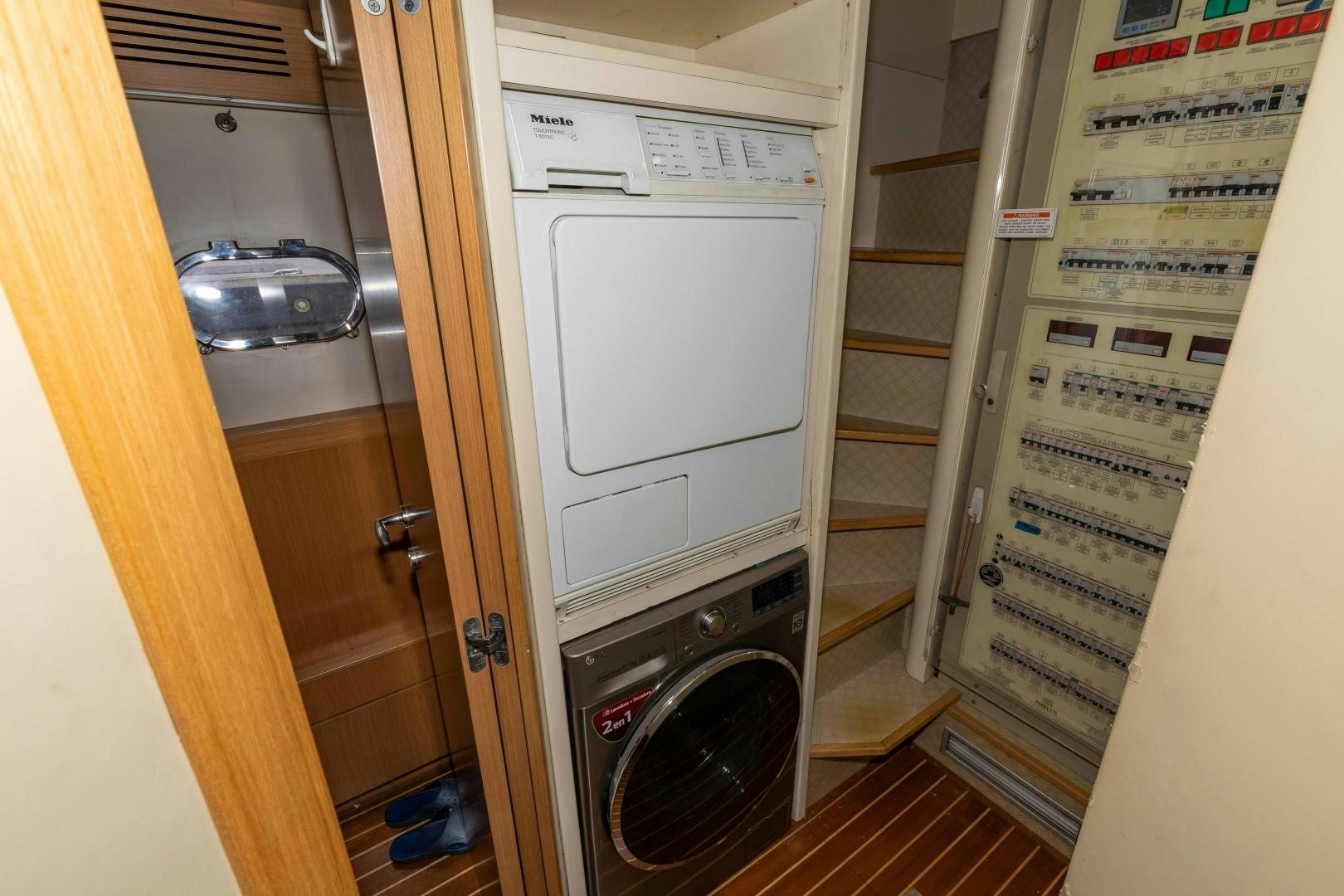 a laundry room with a dryer aboard MI RX Yacht for Sale