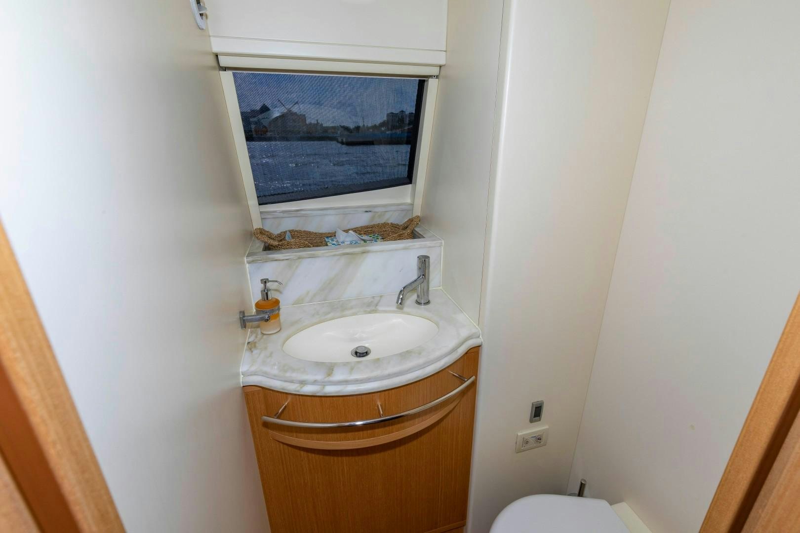 a bathroom with a sink and a mirror aboard MI RX Yacht for Sale
