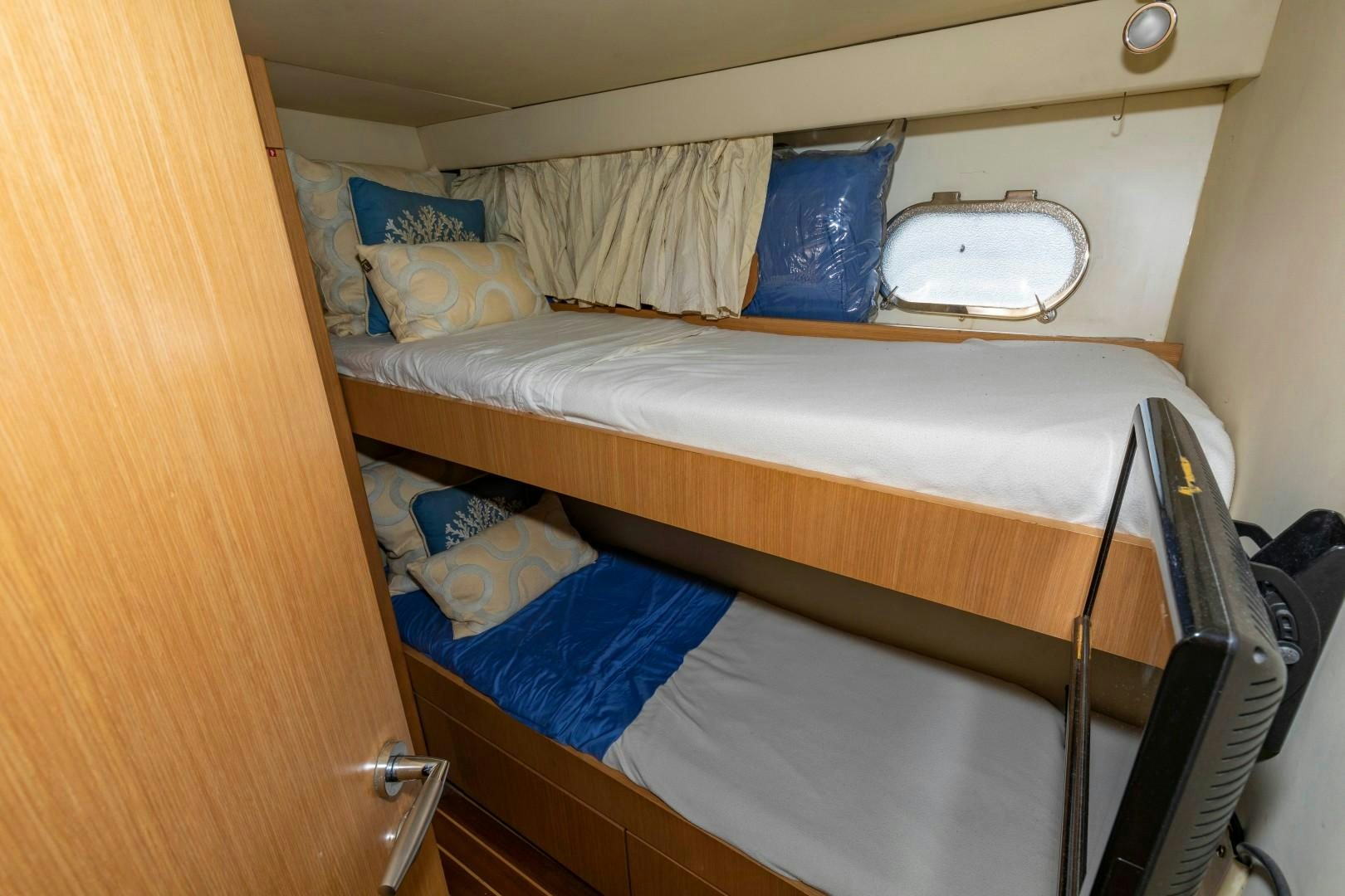 a bed with a couple of beds aboard MI RX Yacht for Sale