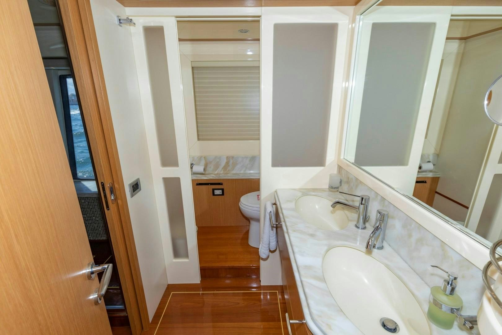 a bathroom with a sink and a mirror aboard MI RX Yacht for Sale