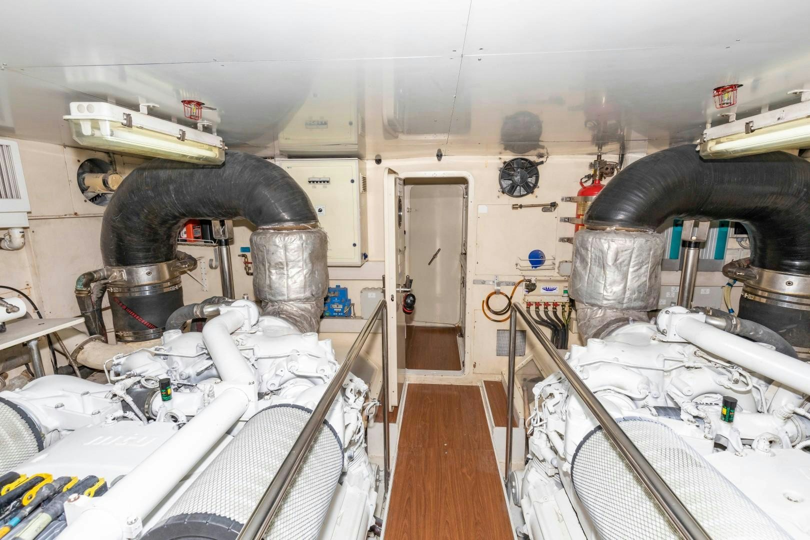 a room with a large metal cylinder aboard MI RX Yacht for Sale