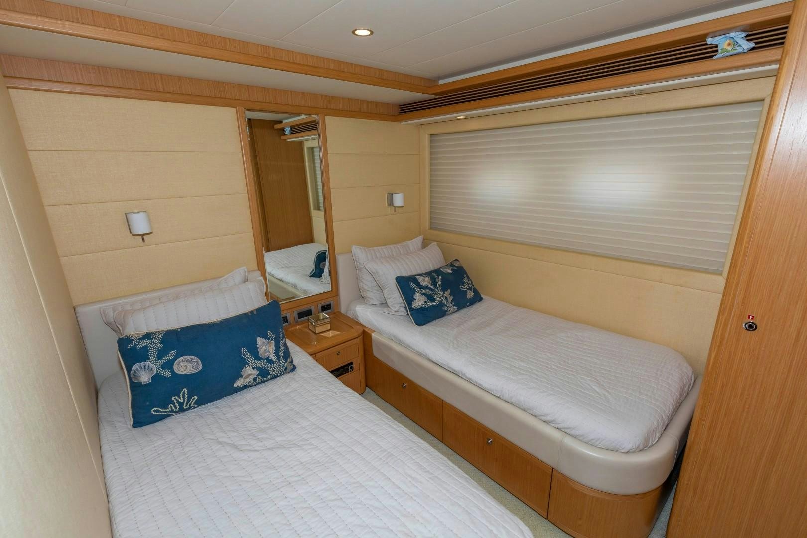 a couple of beds in a room aboard MI RX Yacht for Sale