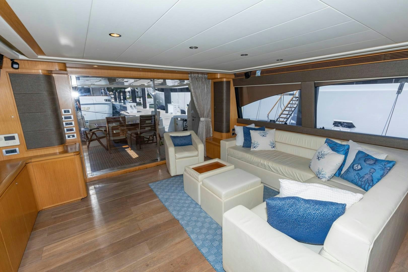 a room with a couch and a table aboard MI RX Yacht for Sale