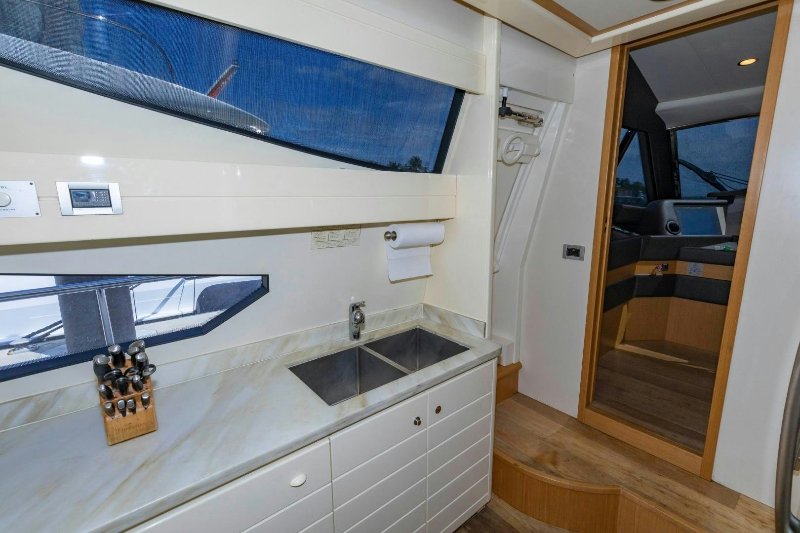 a bathroom with a sink and a mirror aboard MI RX Yacht for Sale