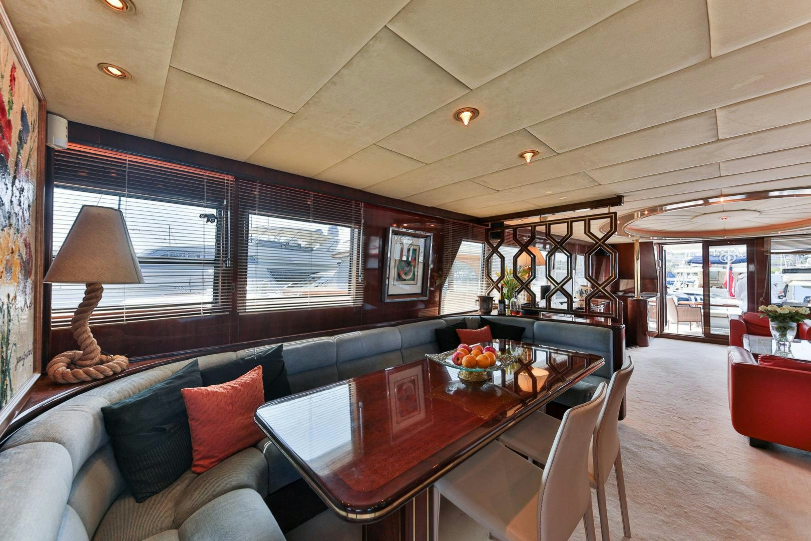 a living room with a table and couches aboard HAPPY DAZE Yacht for Sale