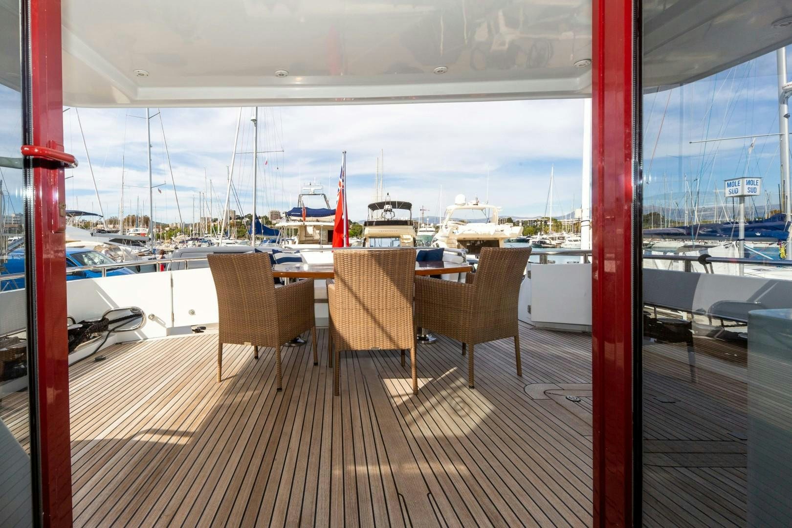 a deck overlooking a marina aboard HAPPY DAZE Yacht for Sale