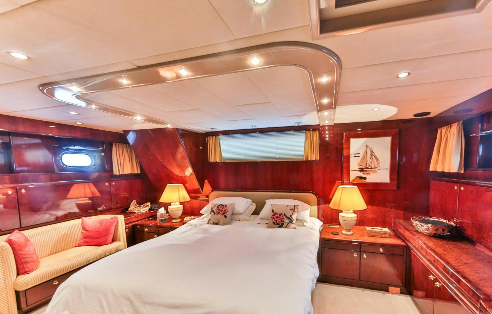 a room with a bed and a desk aboard HAPPY DAZE Yacht for Sale