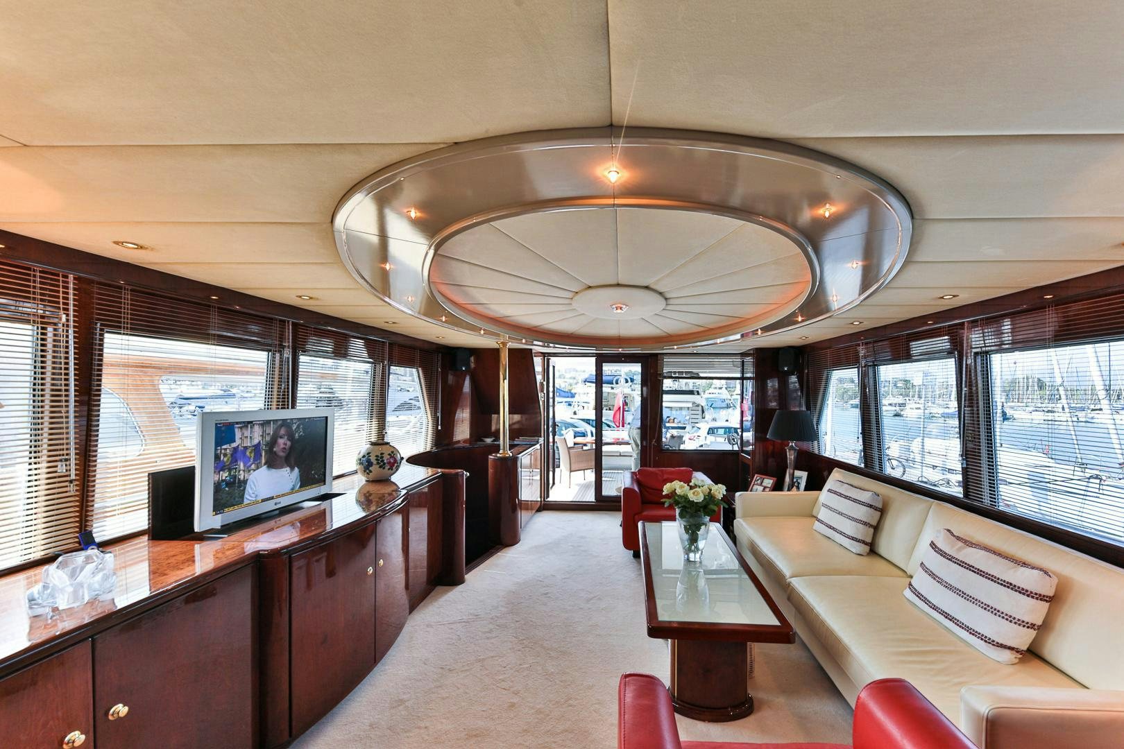a large room with a large window and a large table with chairs aboard HAPPY DAZE Yacht for Sale
