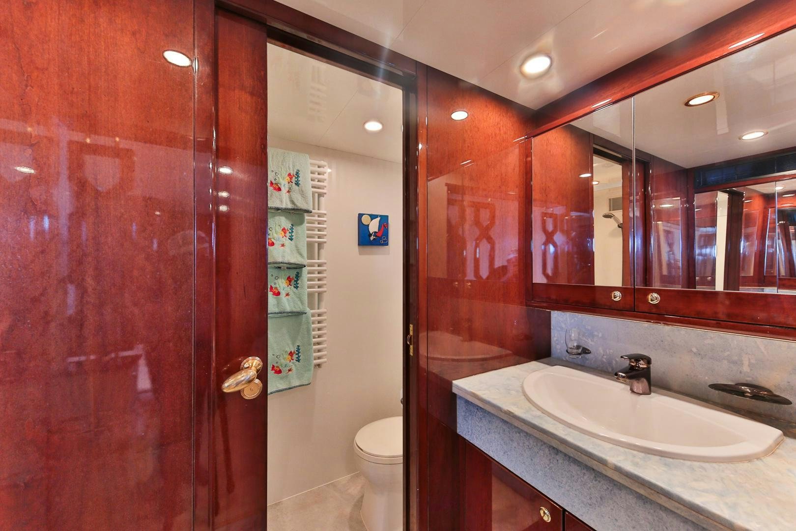 a bathroom with a sink and a mirror aboard HAPPY DAZE Yacht for Sale