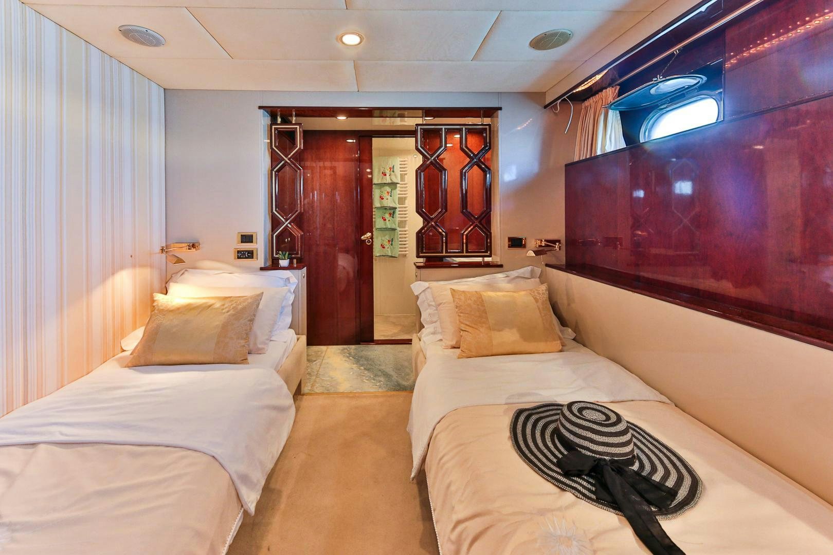 a room with a couple of beds aboard HAPPY DAZE Yacht for Sale