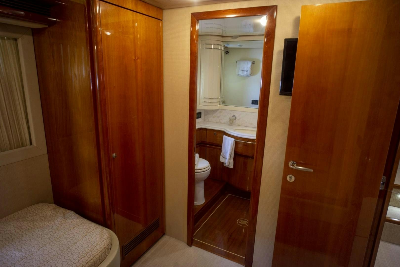 a bathroom with a wood door aboard NO NAME Yacht for Sale