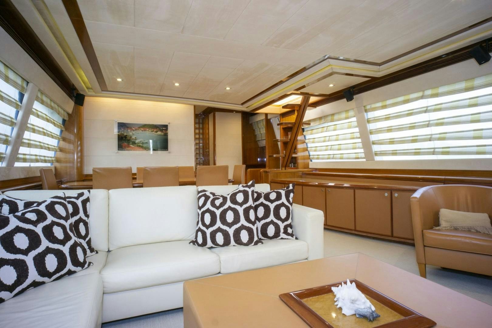 a living room with a couch and a table aboard NO NAME Yacht for Sale