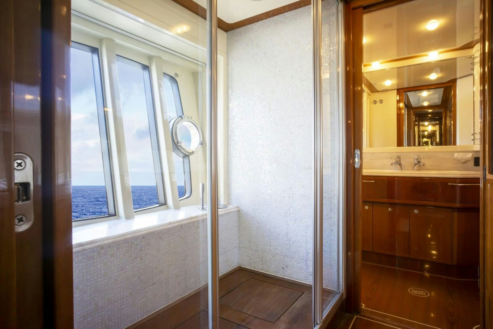 a bathroom with a shower unit and a sink aboard NO NAME Yacht for Sale