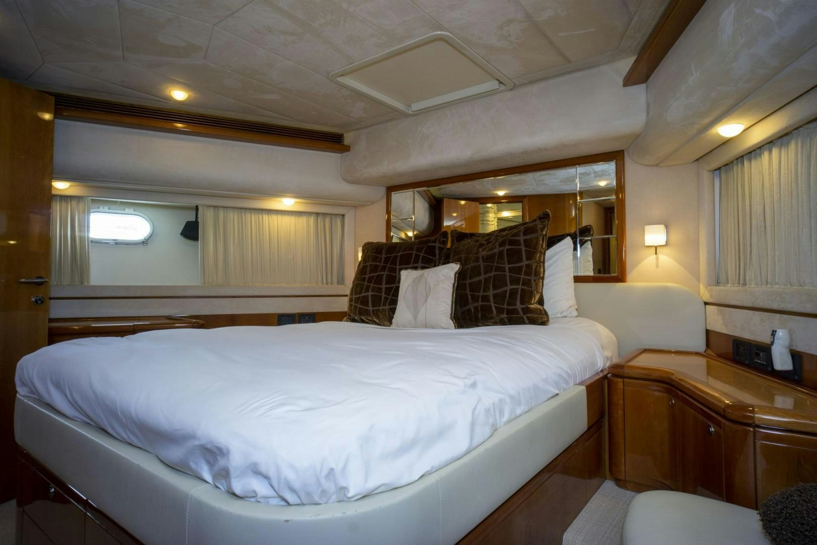 a bedroom with a bed and a mirror aboard NO NAME Yacht for Sale