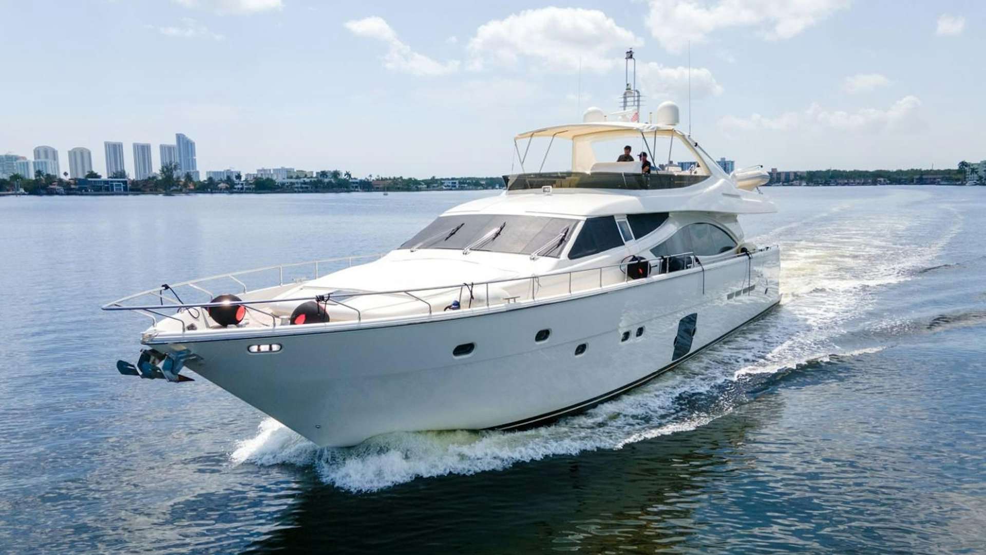 a white yacht on the water aboard No Name Yacht for Sale