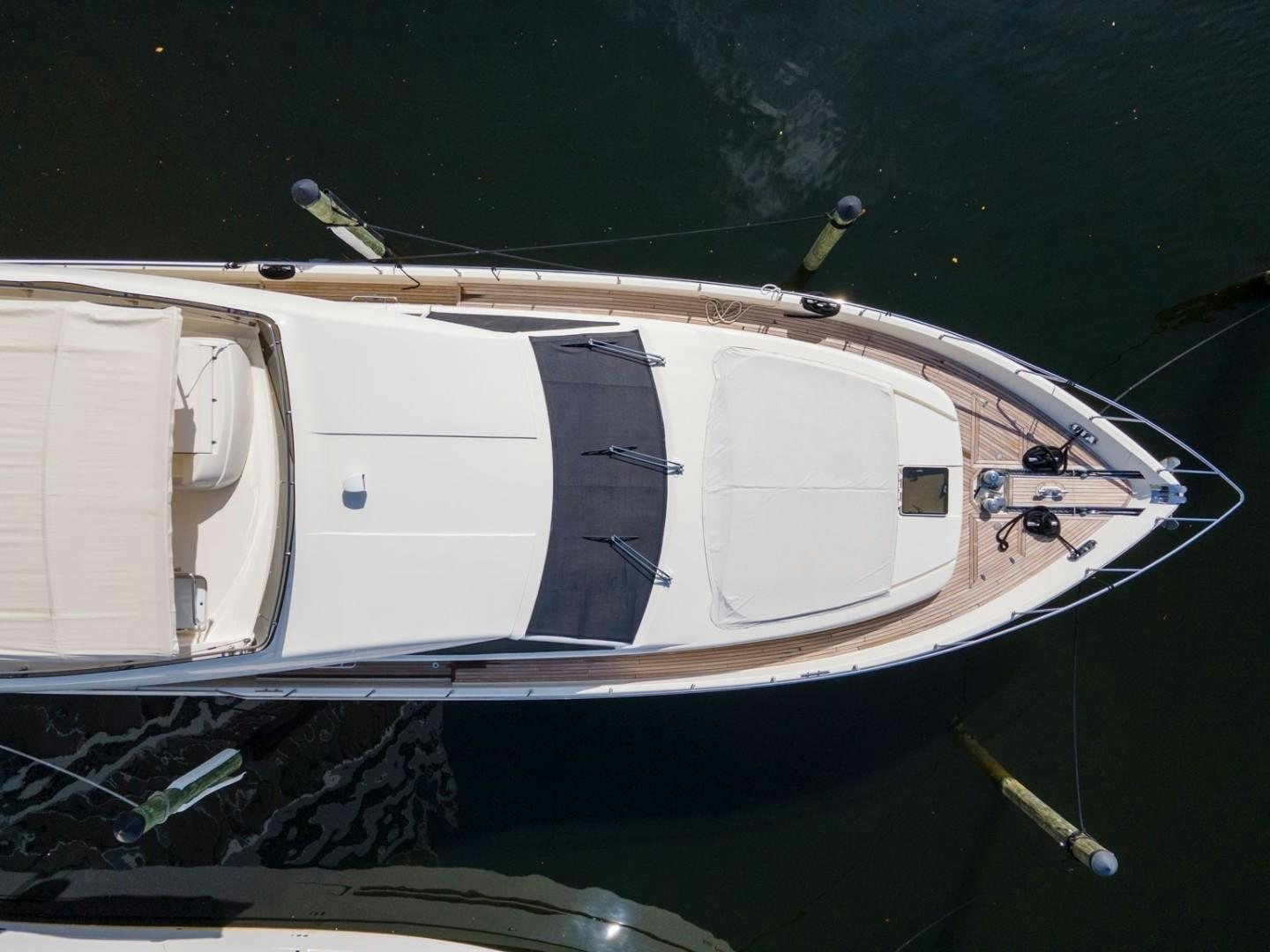 a white boat with a black stripe aboard NO NAME Yacht for Sale