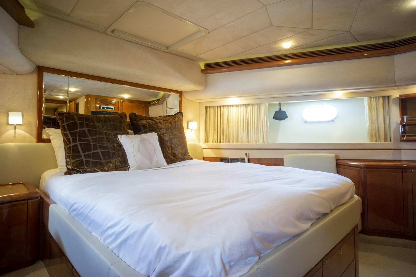 a bedroom with a bed and a mirror aboard NO NAME Yacht for Sale