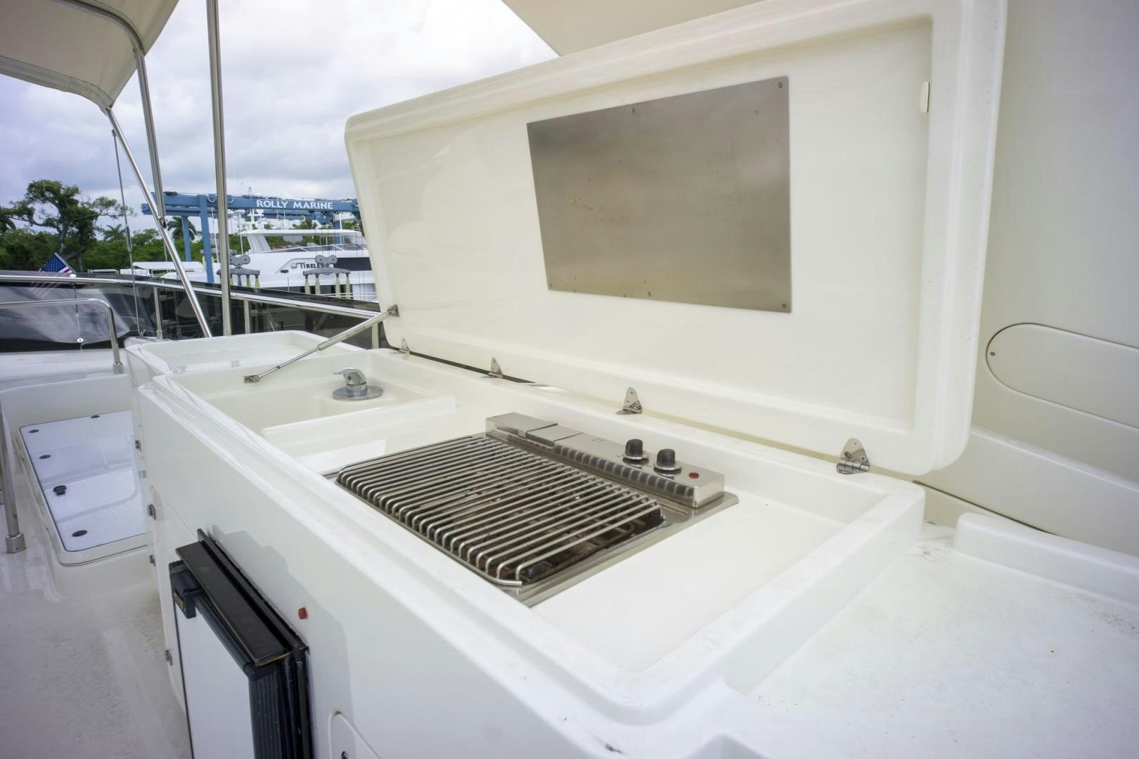 a white boat with a screen aboard NO NAME Yacht for Sale