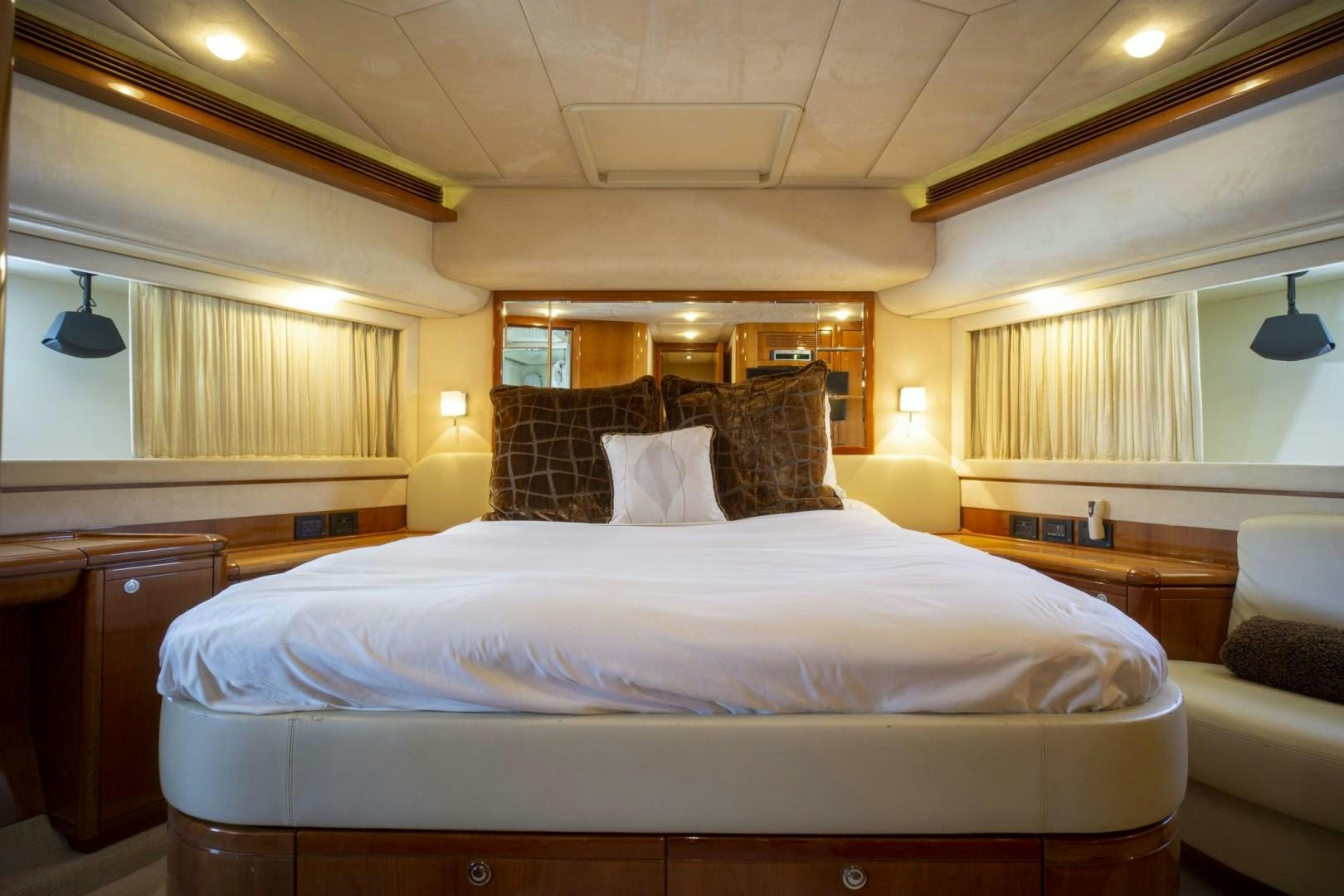 a bed with a white sheet and pillows aboard NO NAME Yacht for Sale