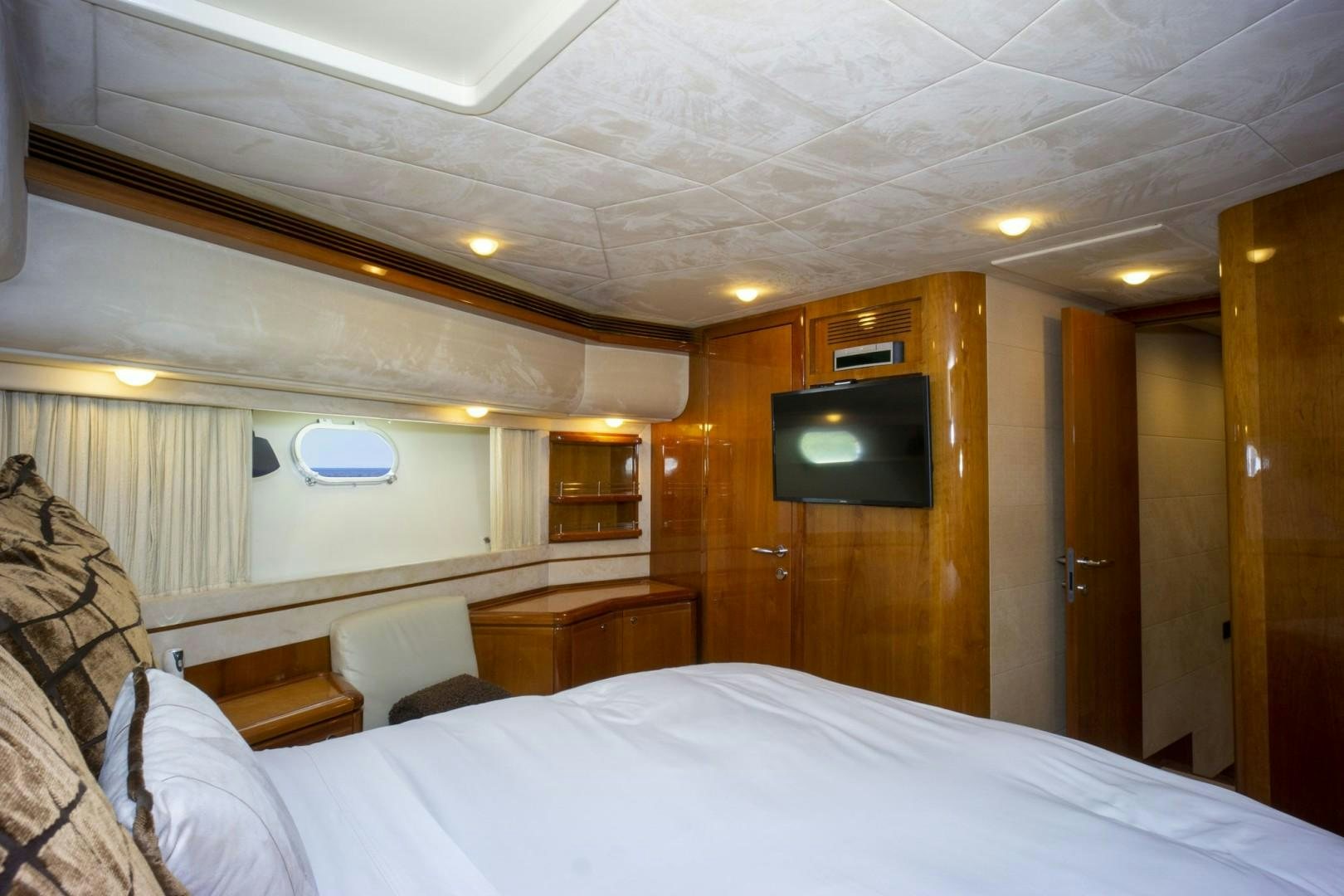 a room with a bed and a television aboard NO NAME Yacht for Sale
