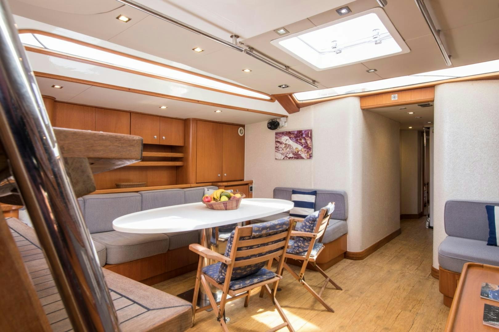 a room with a table and chairs aboard INDIGO Yacht for Sale