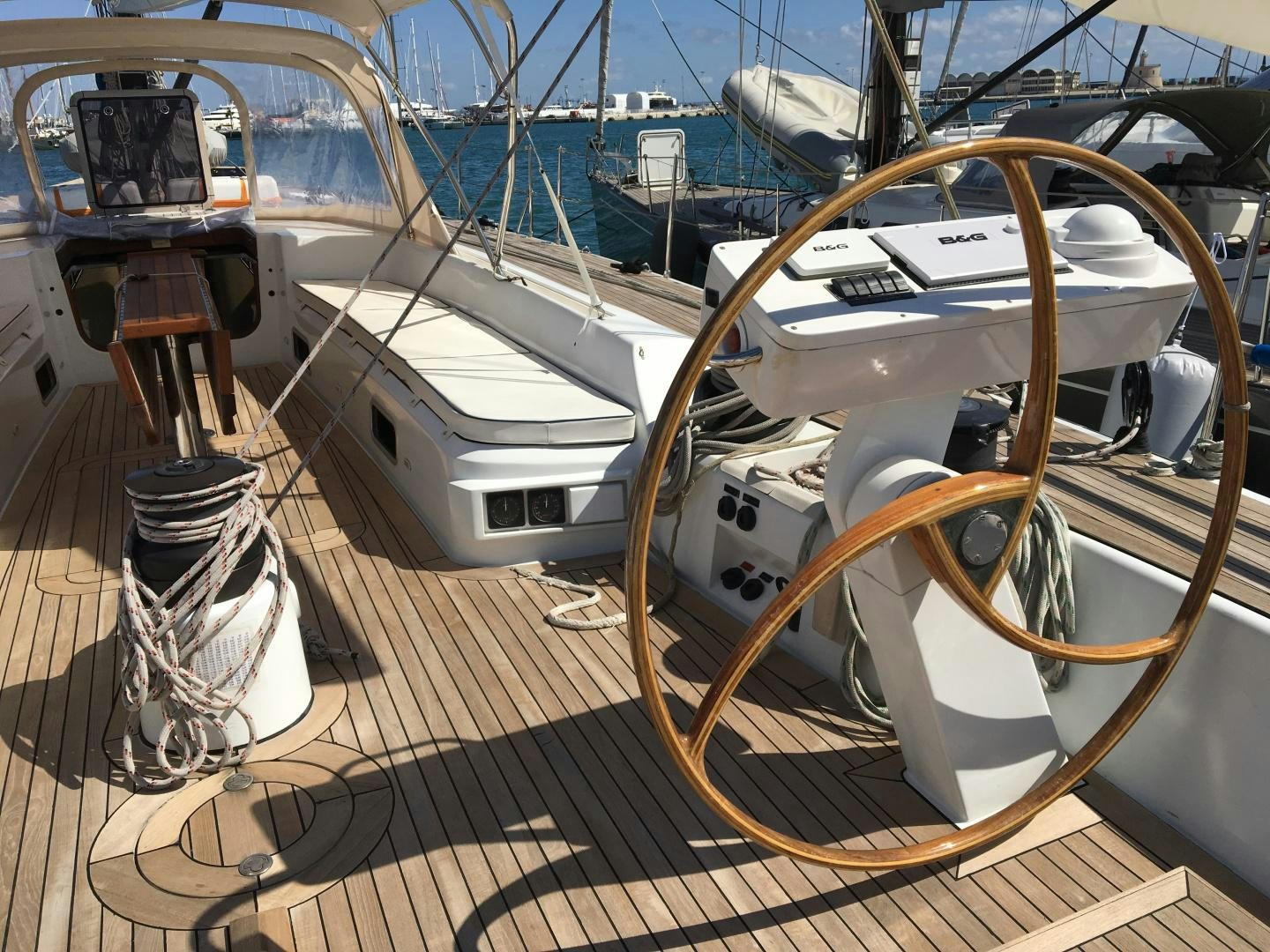 a large white boat on a dock aboard INDIGO Yacht for Sale