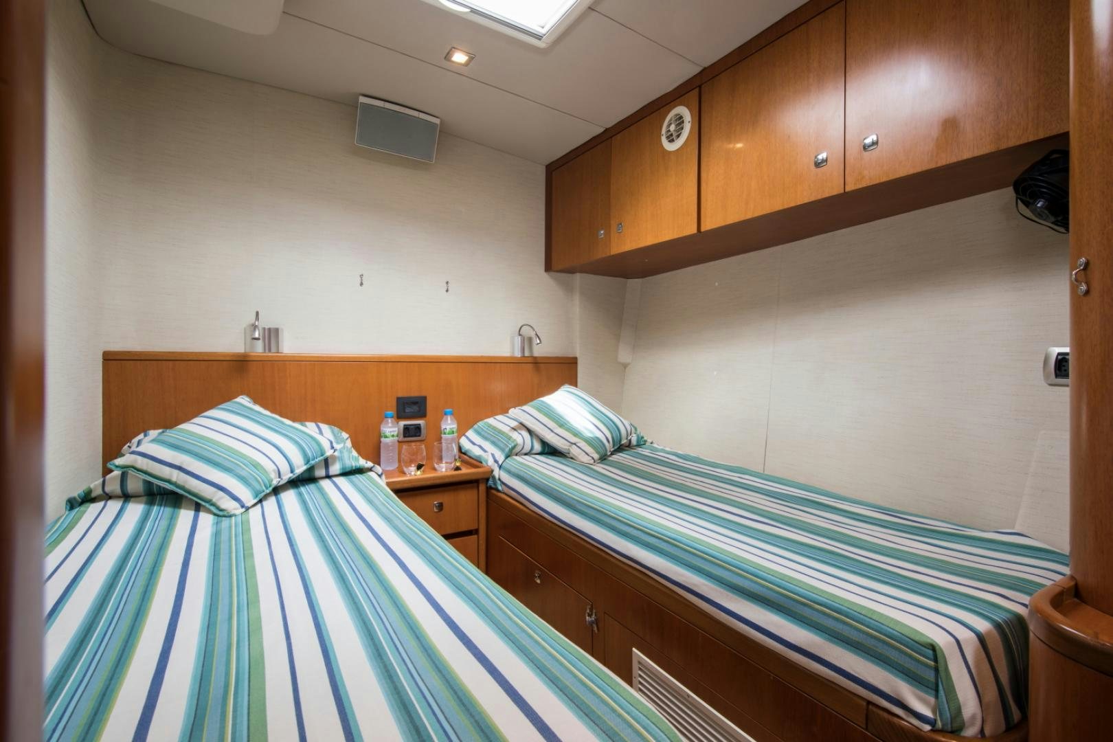 a couple of beds in a room aboard INDIGO Yacht for Sale