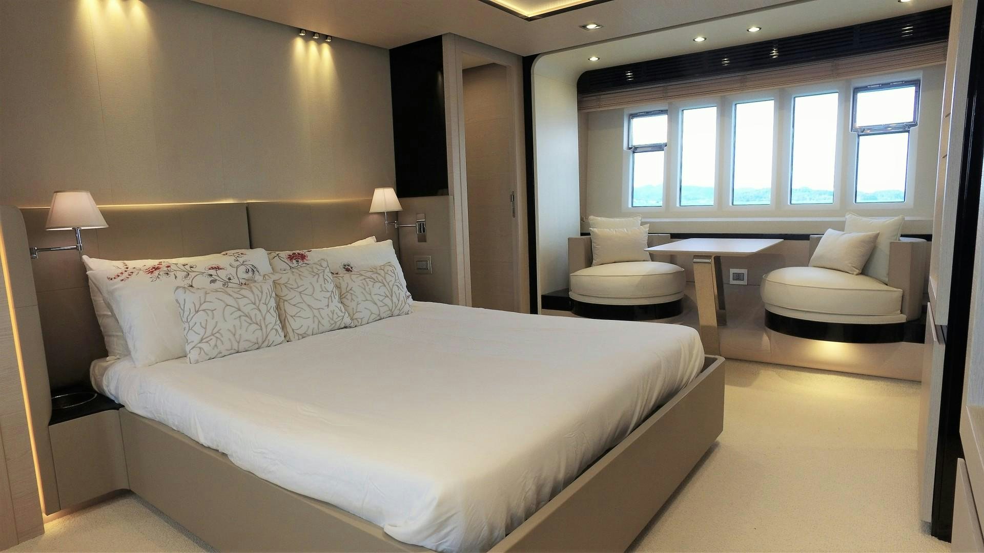 a large bed in a hotel room aboard OKS Yacht for Sale