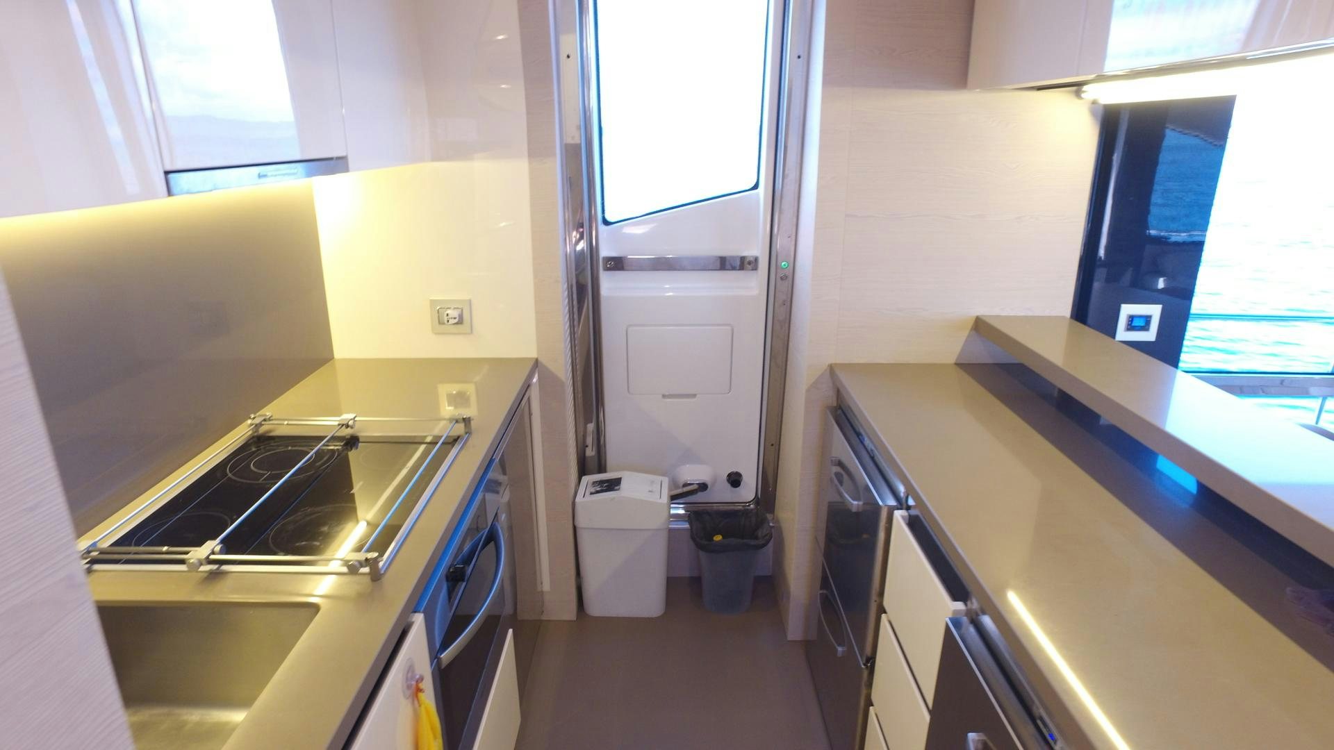 a room with a counter and a sink aboard OKS Yacht for Sale