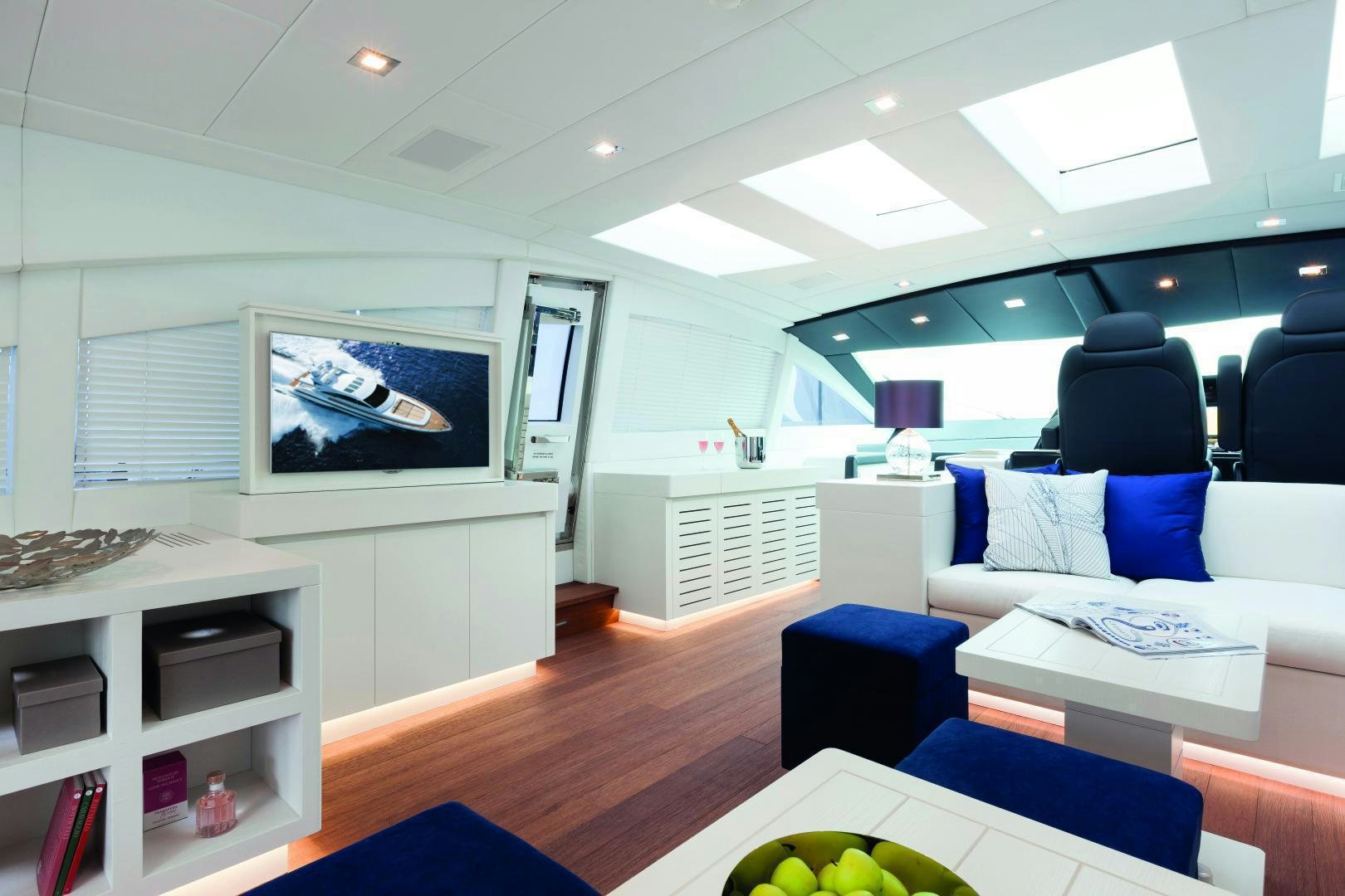 a room with a couch and a television aboard MY TOY Yacht for Sale