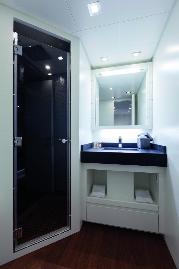 a bathroom with a sink and a mirror aboard MY TOY Yacht for Sale