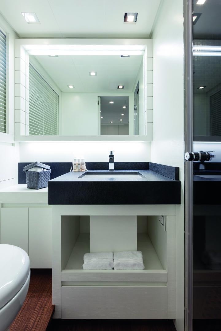 a bathroom with a large mirror aboard MY TOY Yacht for Sale