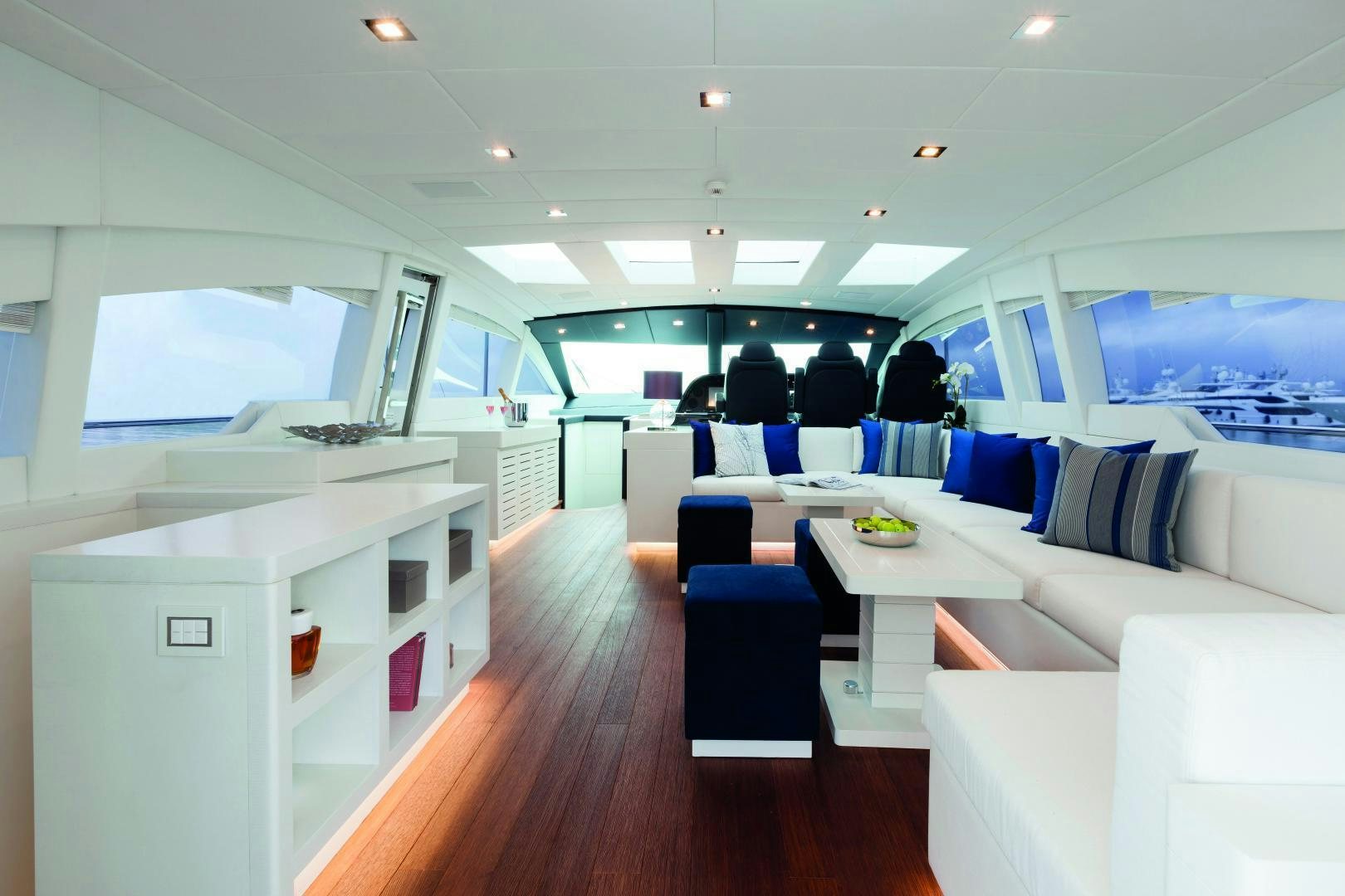 a room with a table and chairs aboard MY TOY Yacht for Sale