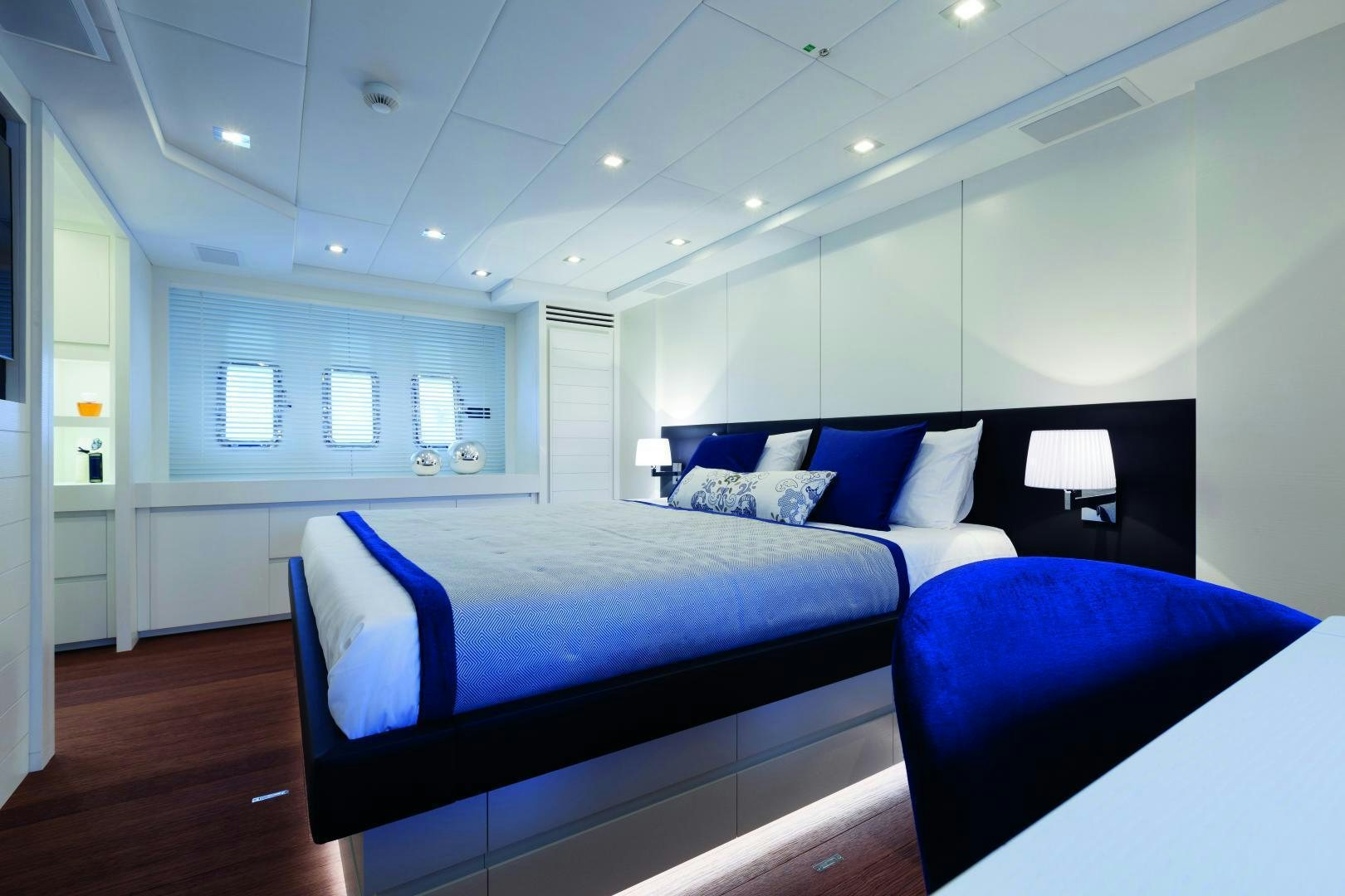 a room with a bed and a desk aboard MY TOY Yacht for Sale