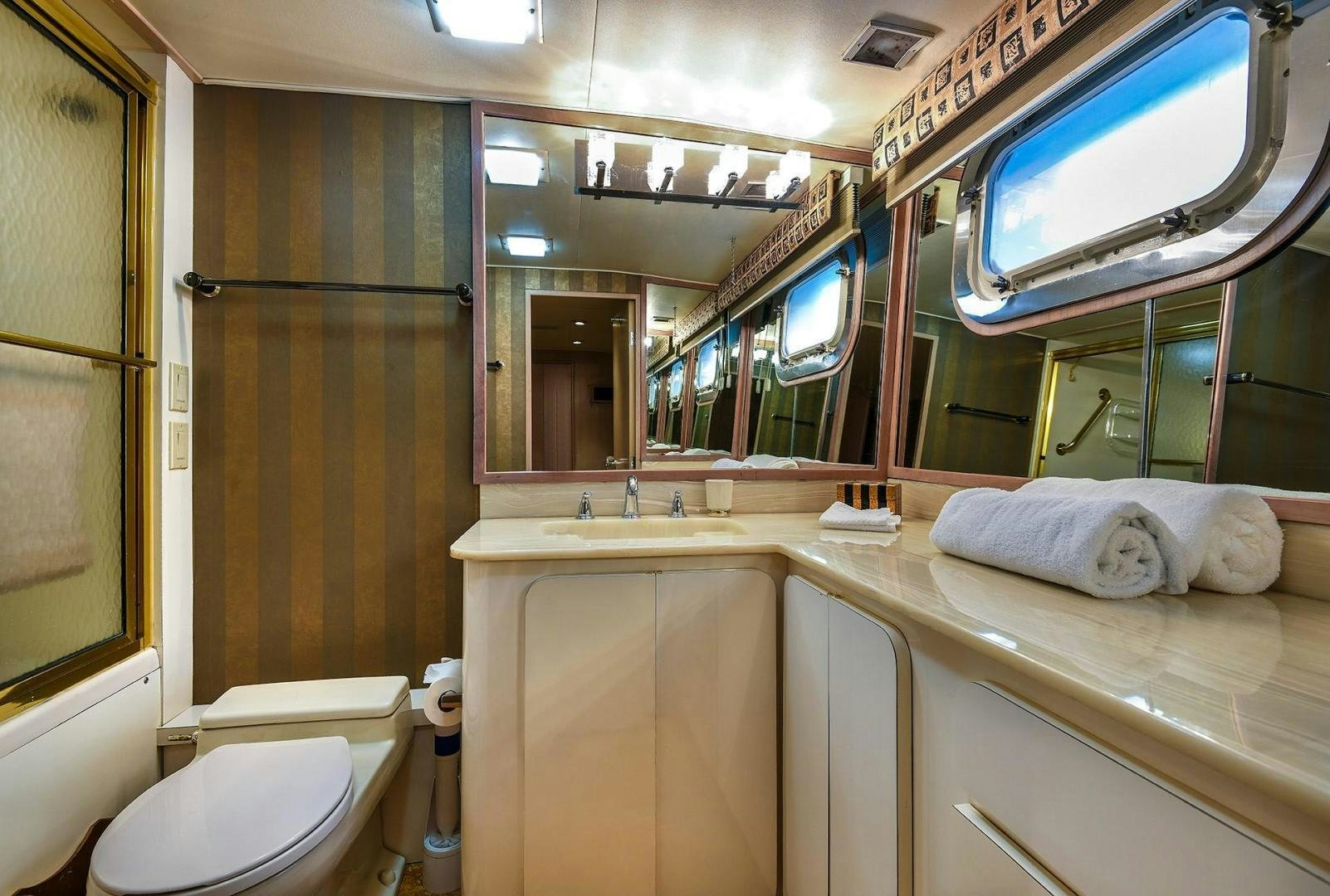 a bathroom with a large window aboard PRIMETIME III Yacht for Sale
