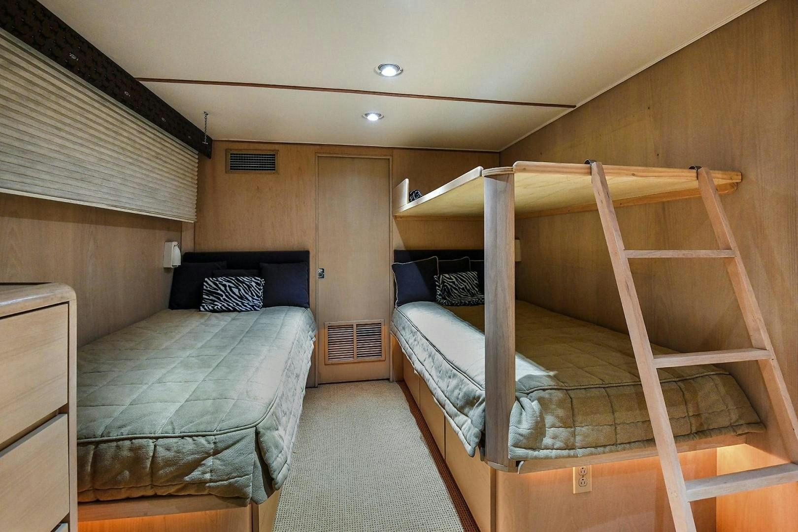 a bunk bed in a cabin aboard PRIMETIME III Yacht for Sale
