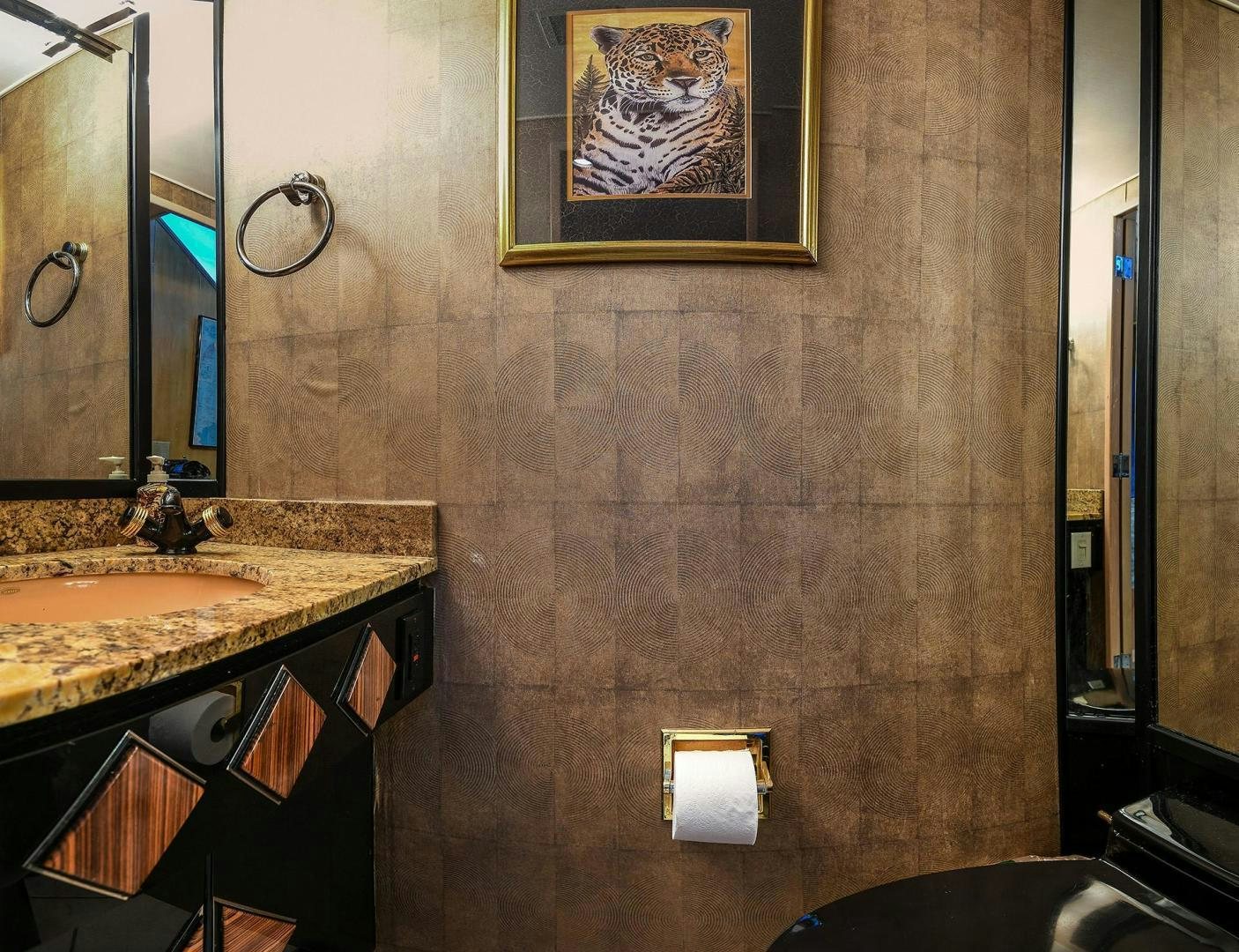 a bathroom with a sink and a mirror aboard PRIMETIME III Yacht for Sale