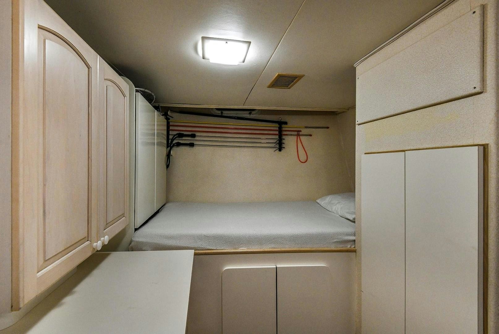 a bed in a room aboard PRIMETIME III Yacht for Sale