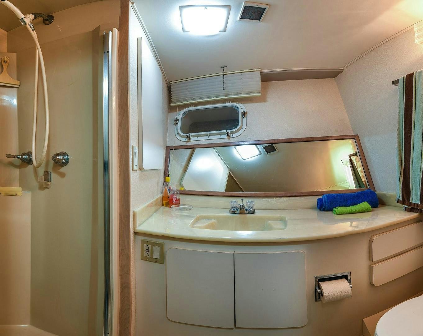 a bathroom with a sink and a mirror aboard PRIMETIME III Yacht for Sale