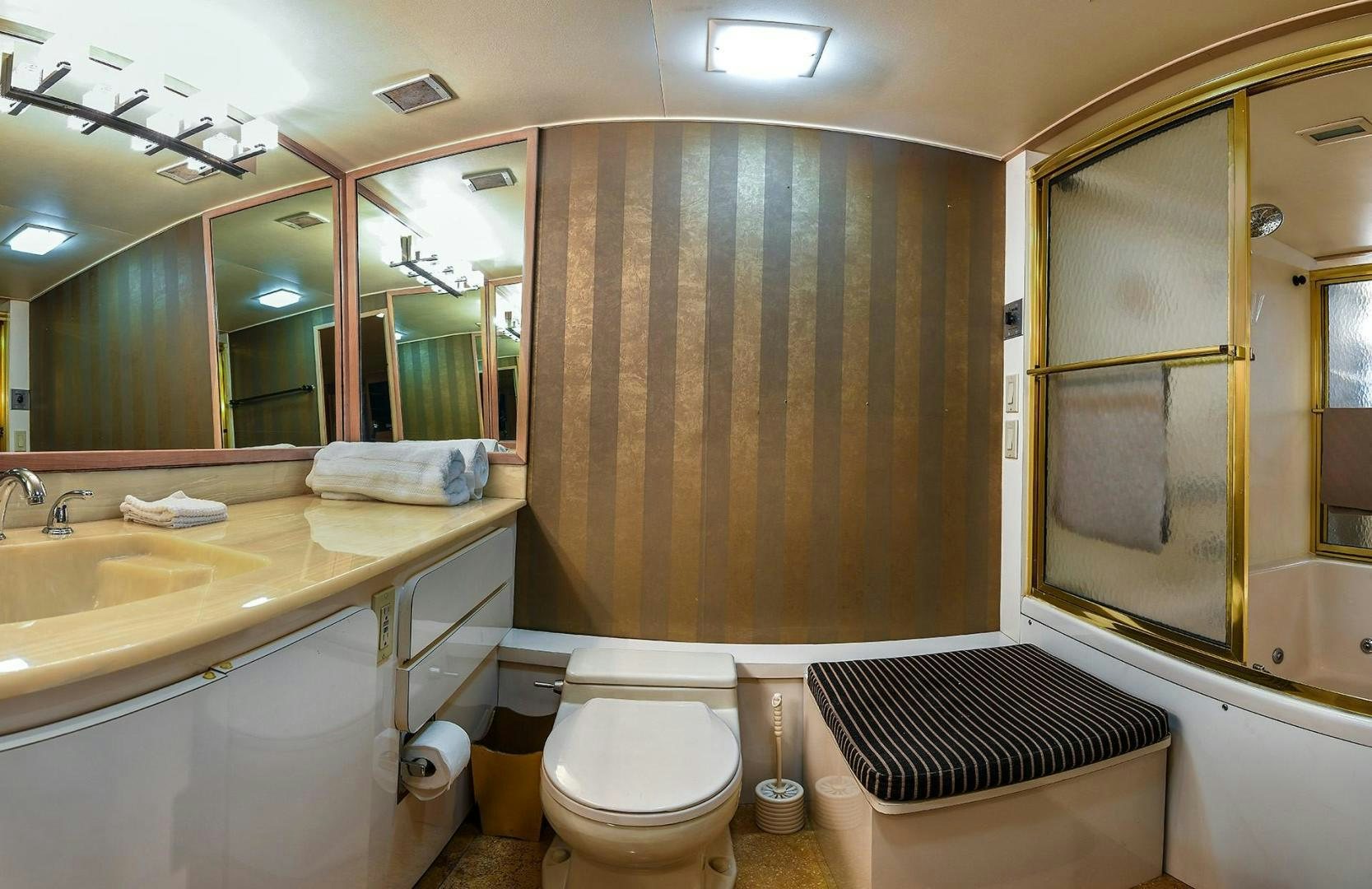 a bathroom with a toilet and a sink aboard PRIMETIME III Yacht for Sale