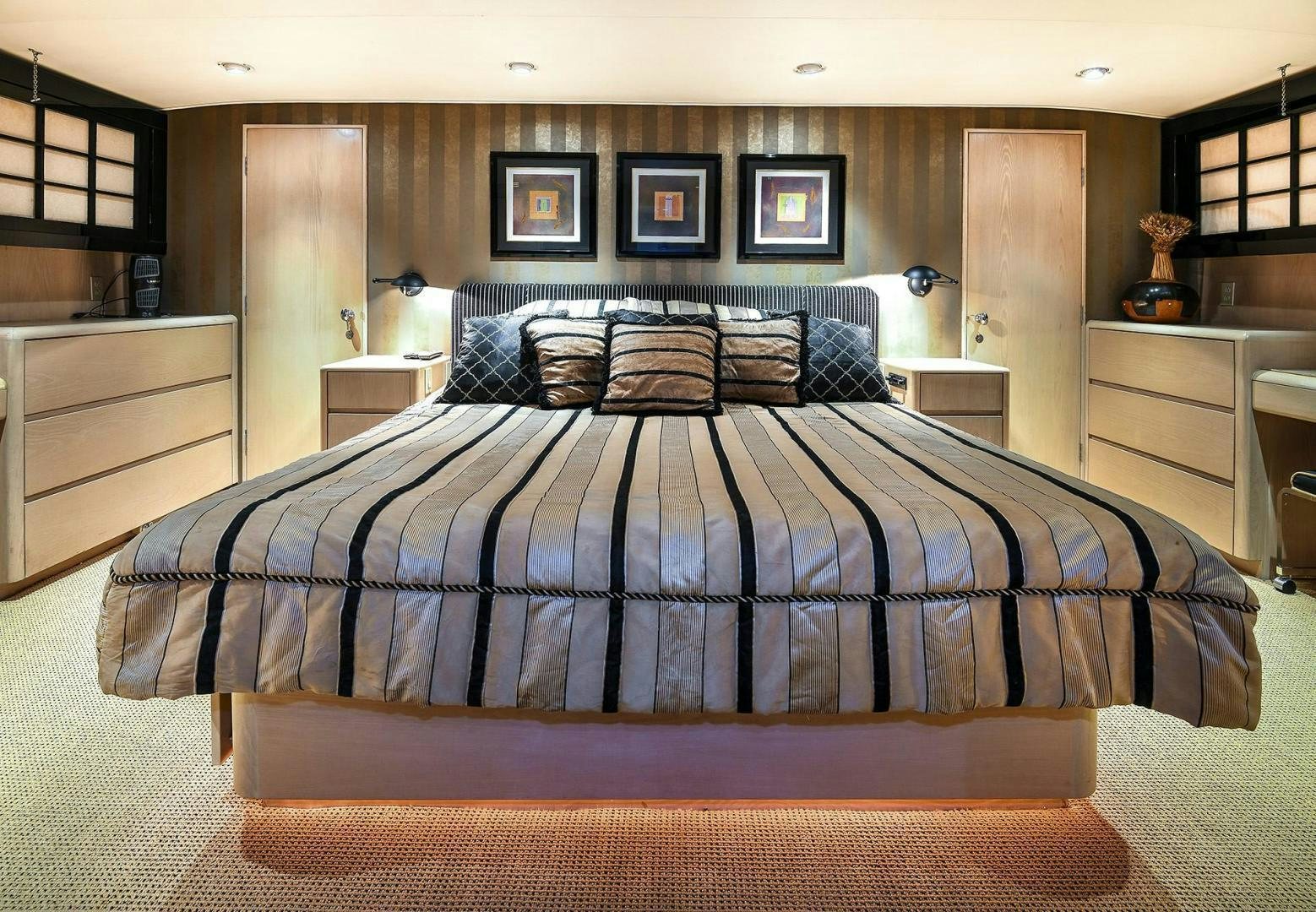 a bed in a room aboard PRIMETIME III Yacht for Sale