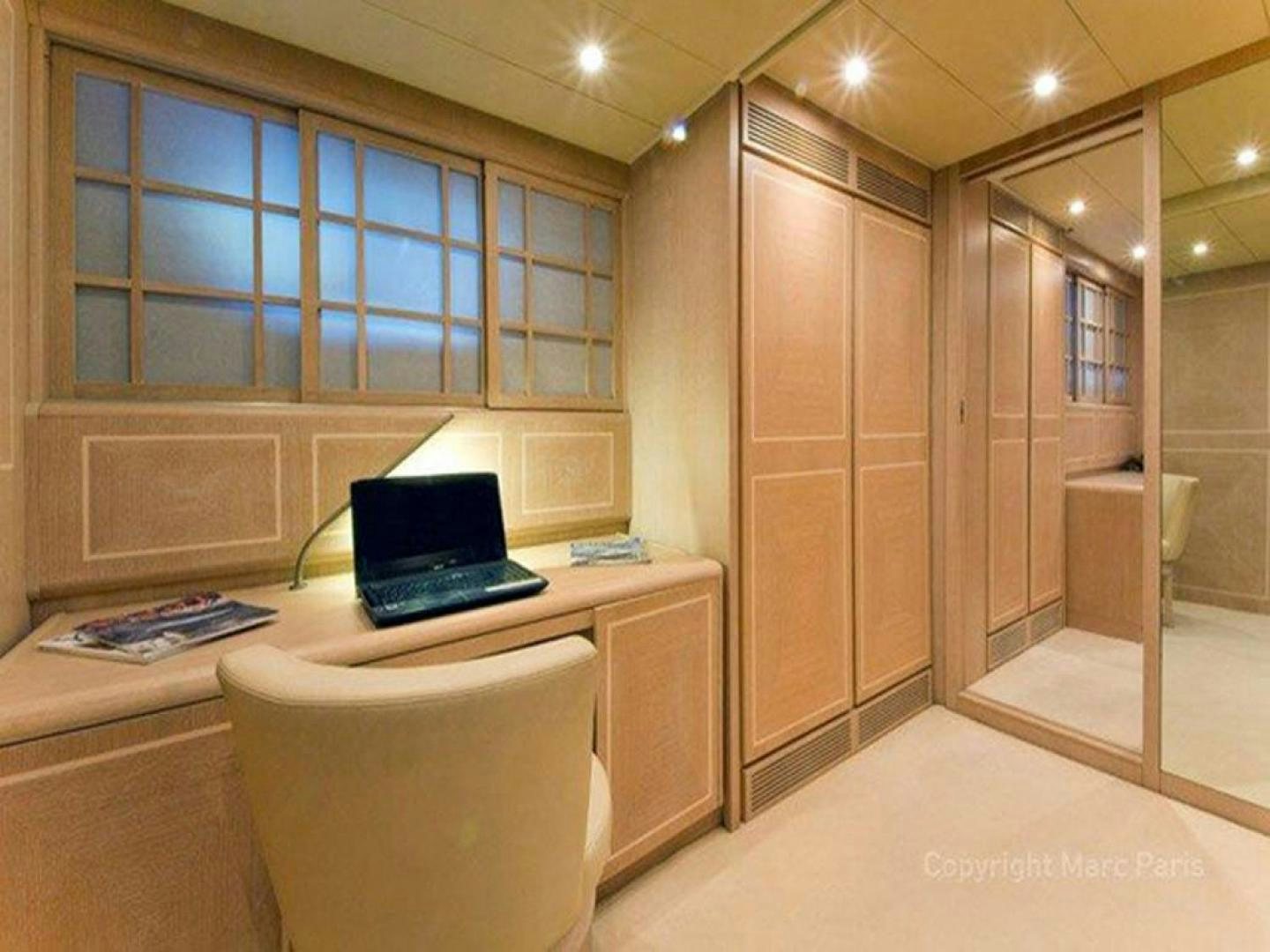 a room with a laptop on a desk aboard COTE D’AZURE Yacht for Sale