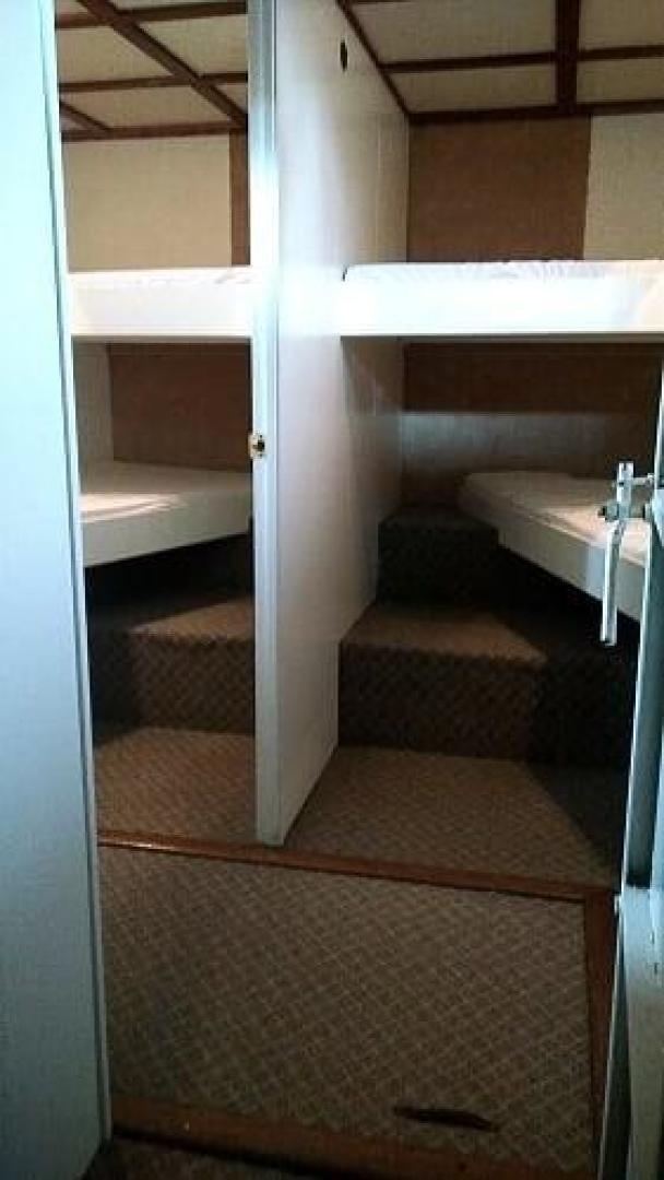 a bathroom with a sink and a mirror aboard LAURA MARIE Yacht for Sale